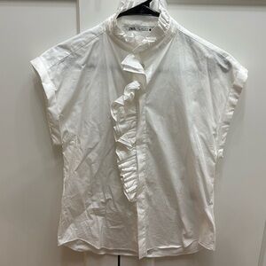 White ruffled sleeveless top